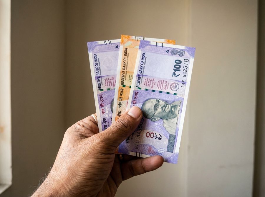 Rupee notes in hand